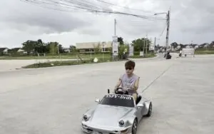 Adult rider testing a mini electric drift kart 72V outdoors