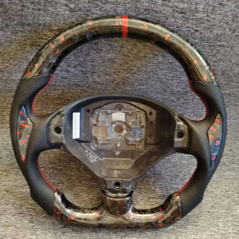 Forged carbon fiber steering wheel for a Peugeot 308 CC and RCZ, showing the marbled pattern