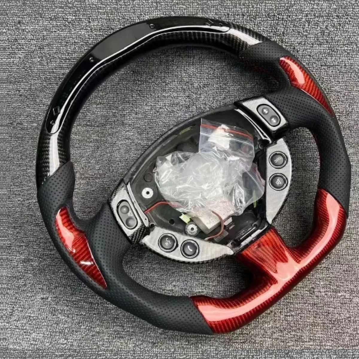 Maserati Ghibli LED carbon fiber steering wheel with a flat-bottom rim, carbon weave and custom grips