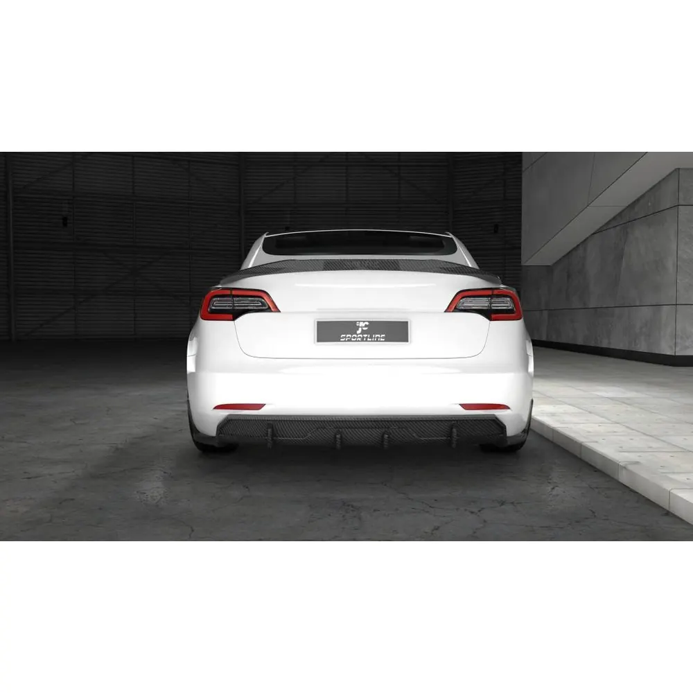 A carbon fiber boot lip spoiler fitted to a Tesla Model 3